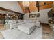 Expansive living room featuring wood beams, a chandelier, and a comfortable sectional sofa at 172 Tennessee Cir, Mooresville, NC 28117