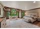 Bright and airy main bedroom with a large window and a decorative wooden beam ceiling at 172 Tennessee Cir, Mooresville, NC 28117