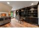 This large office space features custom built-ins and shelving, hardwood floors, and natural light at 172 Tennessee Cir, Mooresville, NC 28117