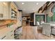 Bright office space with custom built-ins and desk with views of the dining area and outdoor scenery at 172 Tennessee Cir, Mooresville, NC 28117