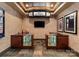 Well-appointed home theater concession area with display cases and movie-themed decor at 172 Tennessee Cir, Mooresville, NC 28117