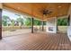Inviting covered porch with wood-burning fireplace, ceiling fan, and spacious layout at 1817 Union St, Charlotte, NC 28205