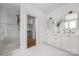 Elegant bathroom showcasing a double vanity, frameless shower, and luxurious finishes at 1817 Union St, Charlotte, NC 28205
