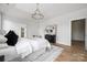 Airy bedroom featuring hardwood floors, stylish furnishings, and neutral decor at 1817 Union St, Charlotte, NC 28205