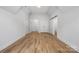 Spacious bedroom with light hardwood floors, white walls, vaulted ceiling and closet doors at 1817 Union St, Charlotte, NC 28205