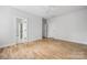 Spacious bedroom featuring hardwood floors and multiple doors at 1817 Union St, Charlotte, NC 28205