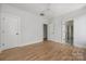 Spacious bedroom with hardwood floors, recessed lighting, and three entryways at 1817 Union St, Charlotte, NC 28205