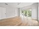 Large bedroom with hardwood floors and big windows offering a verdant view at 1817 Union St, Charlotte, NC 28205