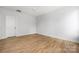 Bright bedroom features hardwood floors, neutral walls, and a modern ceiling fan at 1817 Union St, Charlotte, NC 28205