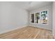 Bright, empty bedroom with hardwood floors and large windows at 1817 Union St, Charlotte, NC 28205