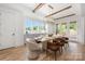 Elegant dining room with stylish chandelier, ample natural light, and seating for dinner parties at 1817 Union St, Charlotte, NC 28205