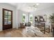 Bright foyer featuring wood floors, large windows, and comfortable seating creates a welcoming entrance to the home at 1817 Union St, Charlotte, NC 28205