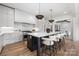 Spacious kitchen featuring a large island with seating, stainless steel appliances, and custom cabinetry at 1817 Union St, Charlotte, NC 28205