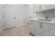 Well-appointed laundry room with stylish cabinetry and a convenient sink at 1817 Union St, Charlotte, NC 28205