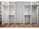 Large closet with custom organizers, shelving, and hanging rods for storage at 1817 Union St, Charlotte, NC 28205