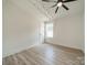 Neutral-toned bedroom with ceiling fan and window at 2003 Briarwood Cir, Fort Mill, SC 29715