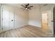 Neutral-toned bedroom with ceiling fan and window at 2003 Briarwood Cir, Fort Mill, SC 29715