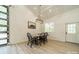 Cozy dining area with a wooden table, modern chandelier, and a window for natural light at 2003 Briarwood Cir, Fort Mill, SC 29715