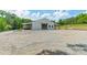 Exterior of building with gravel drive, covered areas and large garage door at 2003 Briarwood Cir, Fort Mill, SC 29715