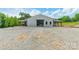 Beautiful white property with gravel driveway and green grass around the property at 2003 Briarwood Cir, Fort Mill, SC 29715