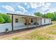 Covered porch with light-colored concrete, wood columns, and space for seating at 2003 Briarwood Cir, Fort Mill, SC 29715