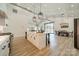 Spacious open-concept kitchen featuring an island and stainless steel appliances, flowing into dining and living areas at 2003 Briarwood Cir, Fort Mill, SC 29715