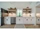 Bright kitchen with stainless steel appliances, open shelving, and modern cabinetry at 2003 Briarwood Cir, Fort Mill, SC 29715