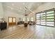 Open living area with a statement window, hardwood floors, and comfortable seating at 2003 Briarwood Cir, Fort Mill, SC 29715
