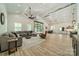 Spacious living room with modern decor, large sectional sofa, and an open floor plan at 2003 Briarwood Cir, Fort Mill, SC 29715