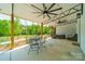 Outdoor covered patio with ceiling fans and dining and lounge seating at 2003 Briarwood Cir, Fort Mill, SC 29715