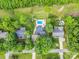 Aerial view of homes with lush greenery, swimming pool, and well-maintained lawns at 208 Wellington Dr, Lincolnton, NC 28092