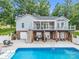 Beautiful home with a spacious backyard featuring an in-ground pool and covered patio at 208 Wellington Dr, Lincolnton, NC 28092
