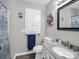 Bathroom featuring floral accents, decorative mirror, and a vanity with granite countertop at 208 Wellington Dr, Lincolnton, NC 28092