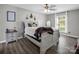 Cozy bedroom with wood-look floors, neutral walls, and natural light from the window at 208 Wellington Dr, Lincolnton, NC 28092