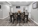 Formal dining room with a wooden table, upholstered chairs, and stylish decor; perfect for entertaining at 208 Wellington Dr, Lincolnton, NC 28092