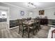 Spacious dining room features wood-look flooring, seating for six, and wainscoting at 208 Wellington Dr, Lincolnton, NC 28092