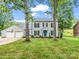Charming two-story home with a spacious two-car garage and a well-manicured lawn at 208 Wellington Dr, Lincolnton, NC 28092