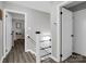 Bright hallway featuring wood-look floors, white trim, and accessible doorways at 208 Wellington Dr, Lincolnton, NC 28092