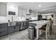 Contemporary kitchen featuring stainless steel appliances, light countertops, and modern gray cabinets at 208 Wellington Dr, Lincolnton, NC 28092