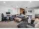 Cozy living area features a large sectional sofa, workspace and adjacent kitchenette at 208 Wellington Dr, Lincolnton, NC 28092