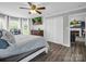 Main bedroom with streaming television and decorative ceiling fan at 208 Wellington Dr, Lincolnton, NC 28092