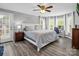 Bright main bedroom with wood-look floors, white trim, and natural light at 208 Wellington Dr, Lincolnton, NC 28092