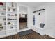 Mud room with built in bench and shelving with brick-look flooring at 208 Wellington Dr, Lincolnton, NC 28092