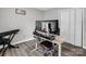 Home office setup with a desk, dual monitors, keyboard and comfortable chair at 208 Wellington Dr, Lincolnton, NC 28092