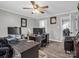 Home office with neutral color scheme, wood-look floors, and ceiling fan at 208 Wellington Dr, Lincolnton, NC 28092