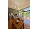 Spacious living area with hardwood floors, exposed brick, large windows, and a comfortable seating arrangement at 2116 Mcclintock Rd # 123, Charlotte, NC 28205