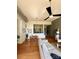 Inviting living area with exposed brick, hardwood floors, and an open layout to the kitchen at 2116 Mcclintock Rd # 123, Charlotte, NC 28205