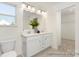 Bright bathroom featuring double sinks, modern fixtures, and ample storage beneath the large vanity at 215 Tillery Ln # 756P, Mount Gilead, NC 27306