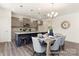 Charming kitchen with granite countertops, stainless steel appliances, and a large island with bar stool seating at 215 Tillery Ln # 756P, Mount Gilead, NC 27306