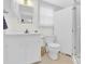 A modern bathroom features a glass shower, toilet, sink with mirror, and white cabinets at 221 Abner Rd, Stony Point, NC 28678